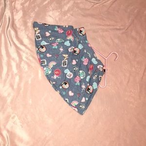 Mint skirt,tie-die jumper,dark pink jeans.